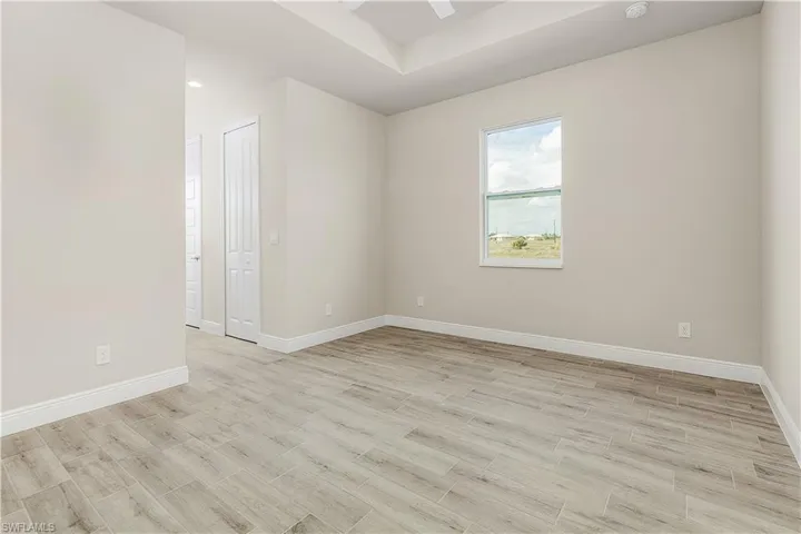 Spare room featuring ceiling fan and light hardwood / wood-style flooring