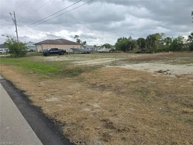 View of one vacant lot before a home toward the East