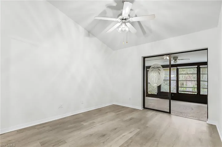 Spare room featuring light wood-style flooring and ceiling fan