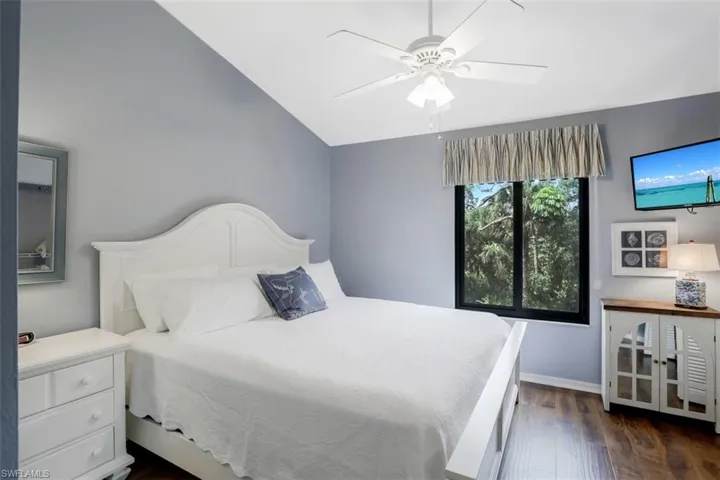Guest bedroom on the second floor with vaulted ceiling.