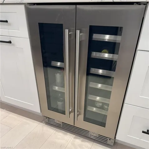 Wine cooler and white cabinetry
