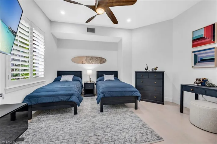 Den or additional guest quarters, with plantation shutters and French doors