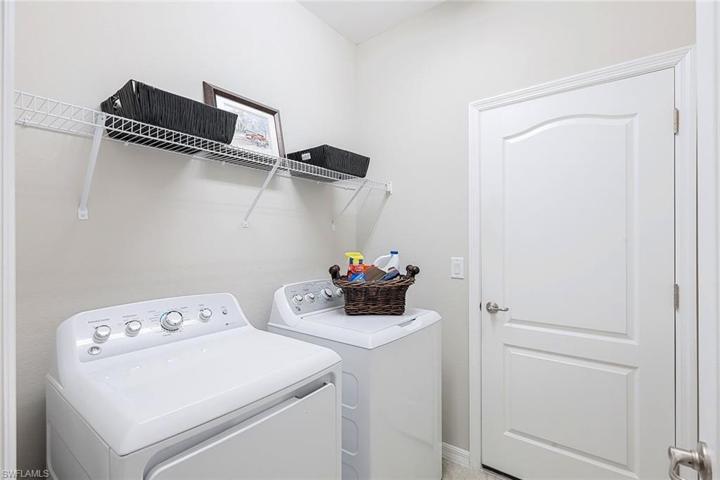 Laundry room with shelving