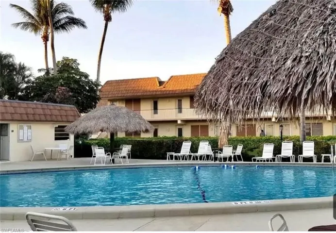 Community pool featuring a patio
