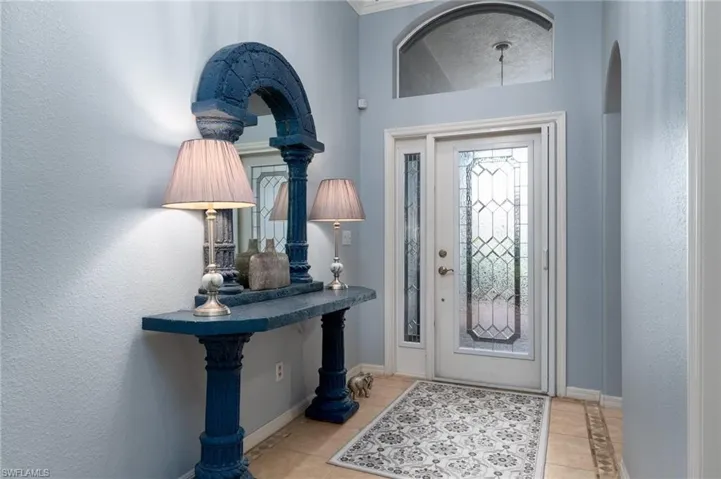 Entryway featuring light tile patterned flooring