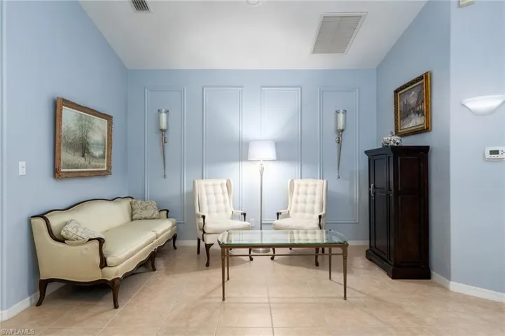 Sitting room with light tile patterned flooring