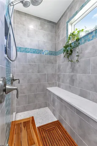 Bathroom featuring tiled shower