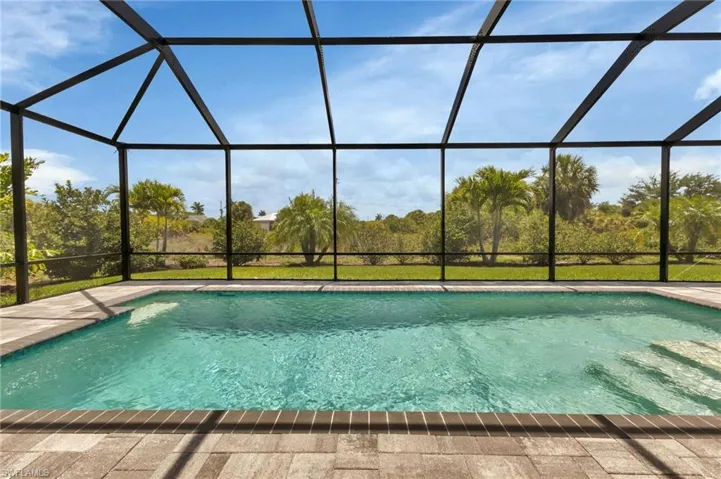View of pool featuring a lanai