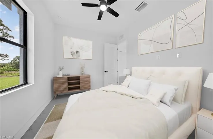 Bedroom featuring a ceiling fan and baseboards