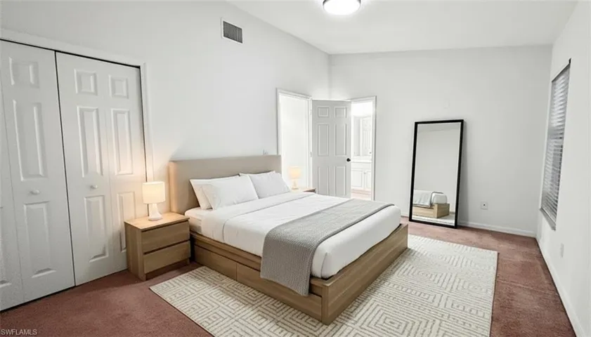 Bedroom with carpet and a closet