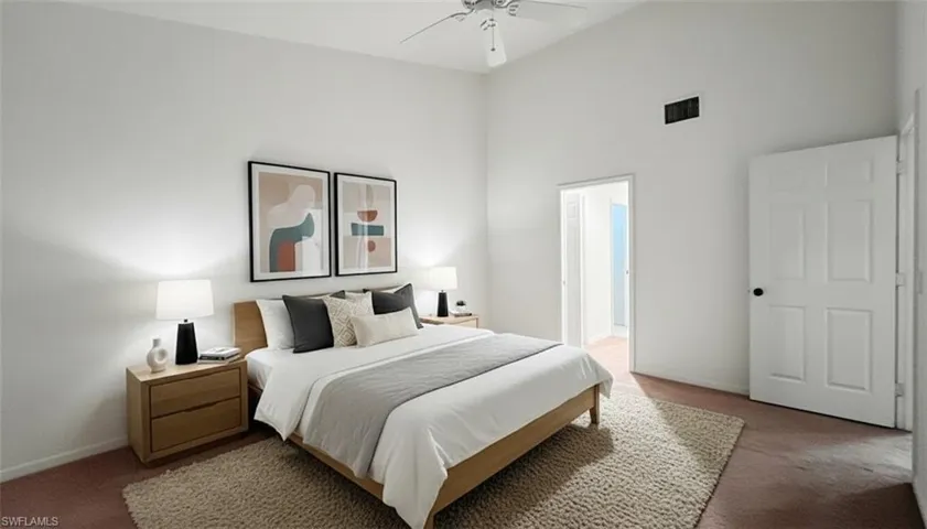 Bedroom with carpet floors, a high ceiling, and ceiling fan
