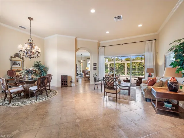 Soaring Ceilings!! Formal Dining & Sitting Area W/ Access to Pool Through Your Hurricane Proof Sliders!