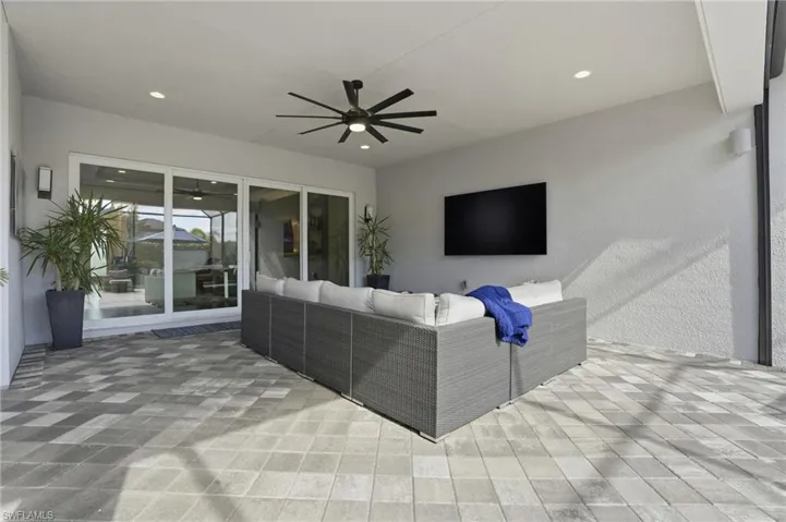 View of patio / terrace featuring ceiling fan and an outdoor living space