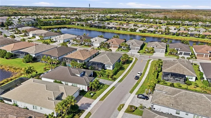 Aerial view of residential area with a large body of water