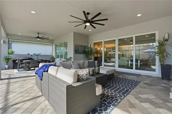 View of patio / terrace featuring ceiling fan, outdoor dining space, and outdoor lounge area