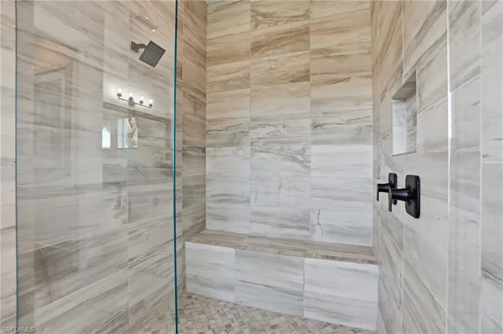 Bathroom featuring a tile shower