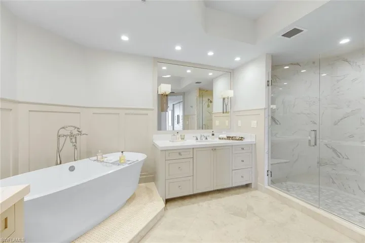 Custom sconces and wood paneling are a lovely finishing touch.
