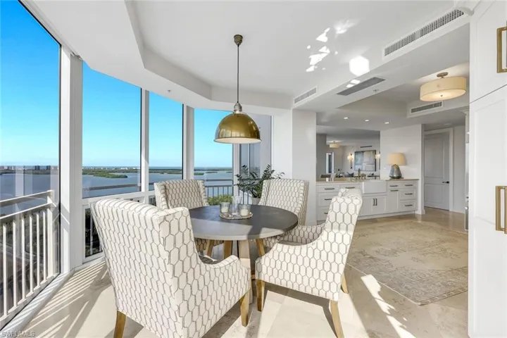 Open to the kitchen, the dining area enhances the home’s open, airy design.