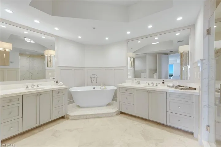 The primary ensuite offers dual vanities, a large soaking tub and a beautifully tiled walk in shower.