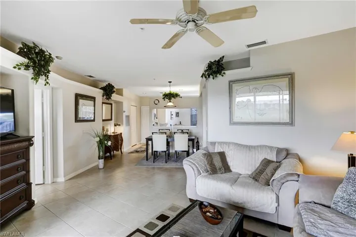 Tiled living room with ceiling fan