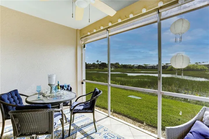Patio with a water view and ceiling fan
