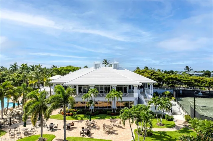 Rear view of property featuring a patio and a fire pit