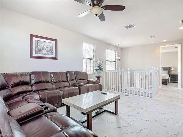 Living room featuring ceiling fan