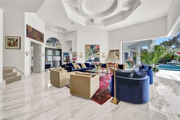 A grande entrance with uninterrupted breathtaking views through the home and pocket doors to yours incredible backyard full of complete tranquility.