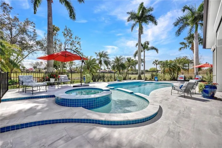 Lovely seating areas offered around the pool with a spa and sun shelf!