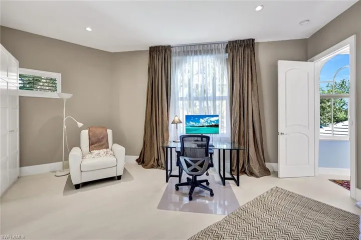 The is the guest bedroom when you come upstairs and this room has another sitting room next to it with the balcony overlooking the best lake and golf view in Shadow Wood.  Plenty of space for 2 families or one family with children.