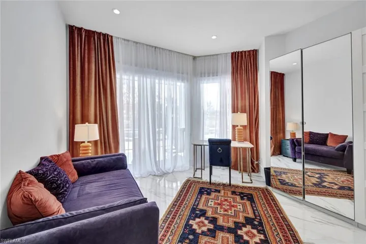 Den/Office on main floor overlooking the pool! This room is behind the double doors that lead to your master.  You will never want to leave your master retreat space.