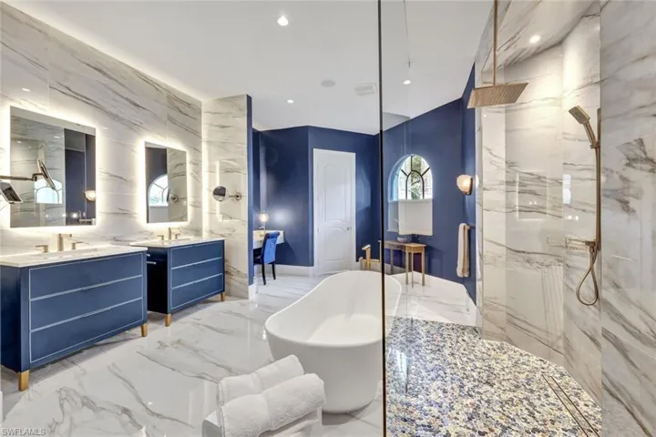 Separate vanities with backlit frameless updated mirrors and an additional makeup vanity!