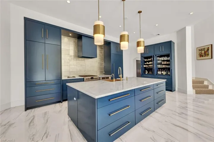 Paneled appliances that blend seamlessly and a double sided island with wonderful storage space!