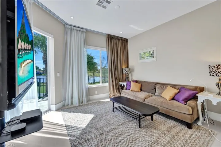 Upstairs guest suite living room with direct balcony access!