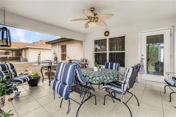 View of patio featuring a ceiling fan and outdoor dining area