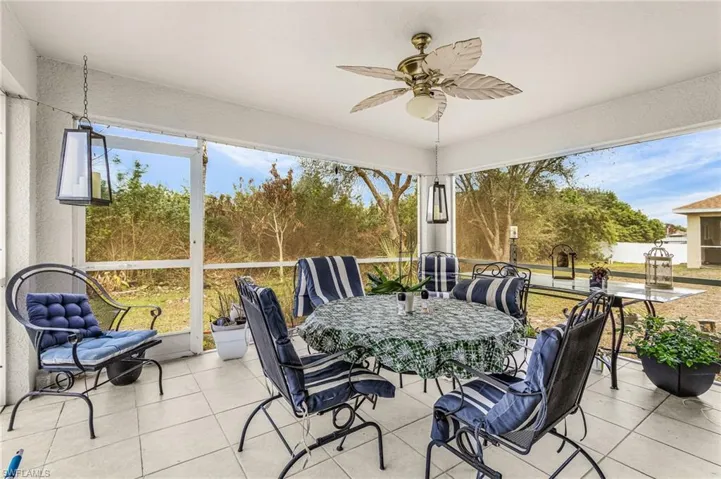 Sunroom / solarium with tile patterned floors