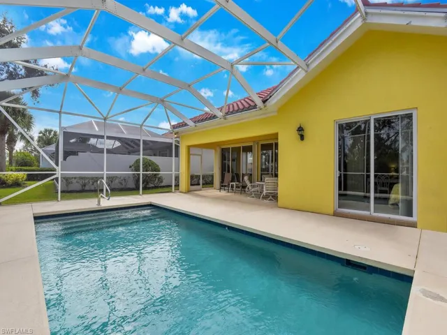View of pool featuring a patio area and a lanai