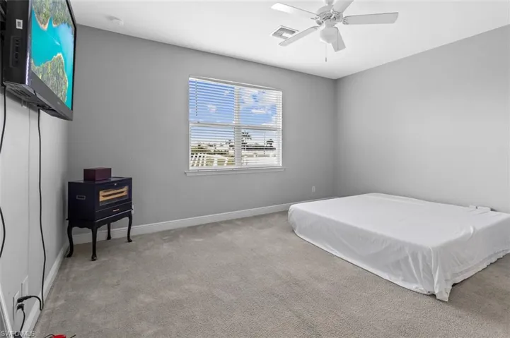 Bedroom featuring carpet flooring and ceiling fan
