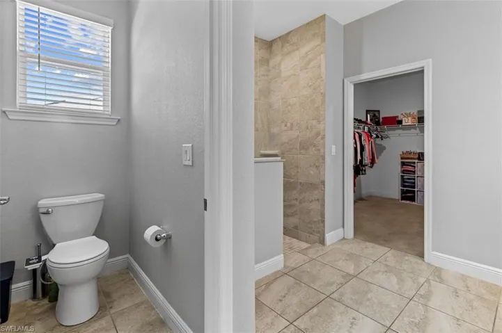 Bathroom featuring tile flooring and toilet