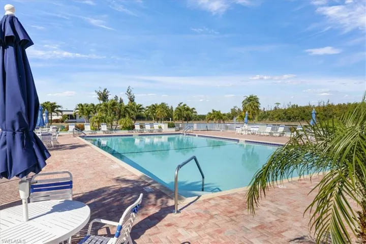 Community pool featuring a patio area
