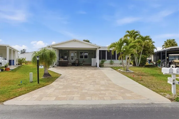 View of front of property featuring a front lawn