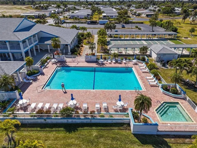 Community pool with a patio