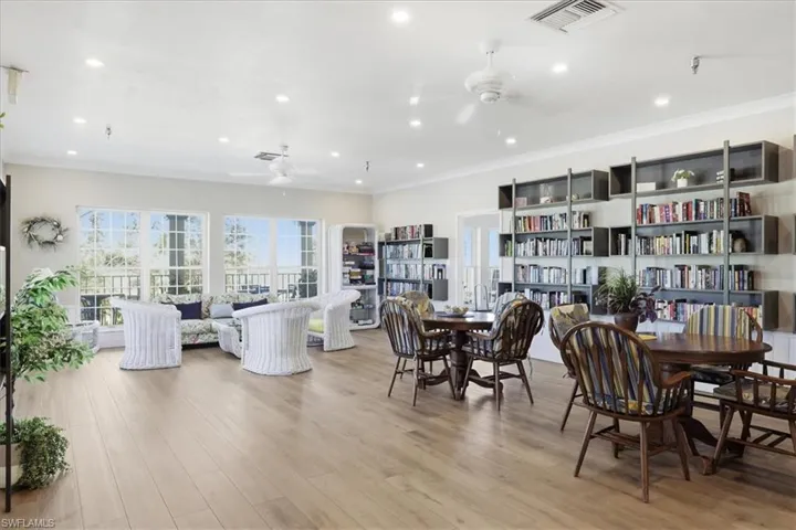 Dining room featuring light wood-style floors, ornamental molding, recessed lighting, and a ceiling fan
