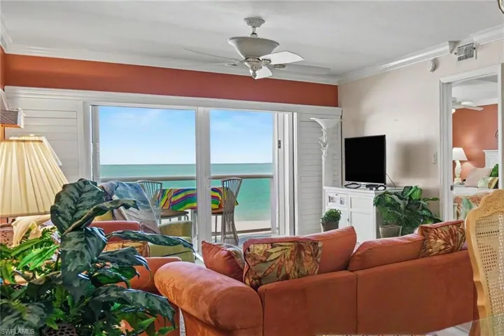 GULF VIEW IS AMAZING.  ENJOY THE OPEN AIR LANAI OR LOWER THE REMOTE CONTROLLED NEW NO-SEEUM PICTURE WINDOW SCREEN.  LANAI ALSO HAS ELECTRIC SHUTTER.  ENTRANCE TO PRIMARY SUITE IS SHOWN AT RIGHT.  PLANTATION SHUTTERS FOR LANAI IMPACT SLIDING DOOR.