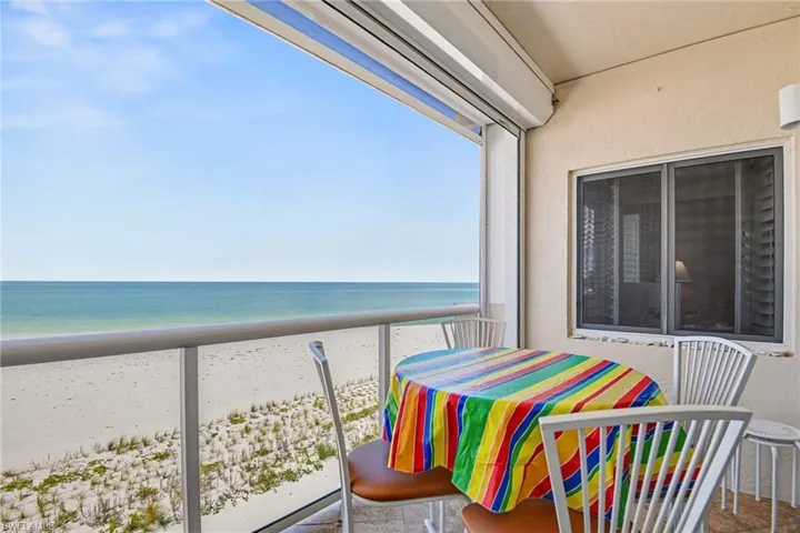 DIRECT GULF VIEW FROM THE TILED LANAI.  NEW REMOTE CONTROLLED PICTURE WINDOW NO-SEEUM SCREEN.  ALSO, METAL ELECTRIC SHUTTERS.  IMPACT RESISTANT OWNER'S SUITE WINDOW SHOWN.  ENTRANCE TO LIVING AREA IS TO RIGHT.
