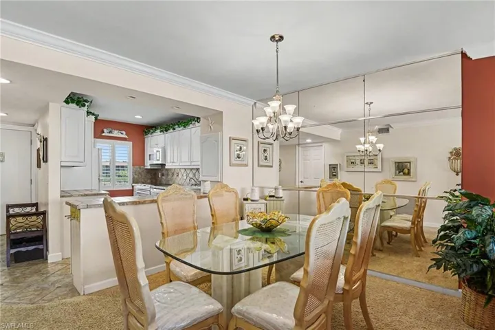 DINING AREA.  UNIT ENTRANCE IS SHOW AT LEFT.