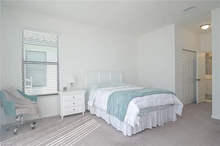 Bedroom with carpet