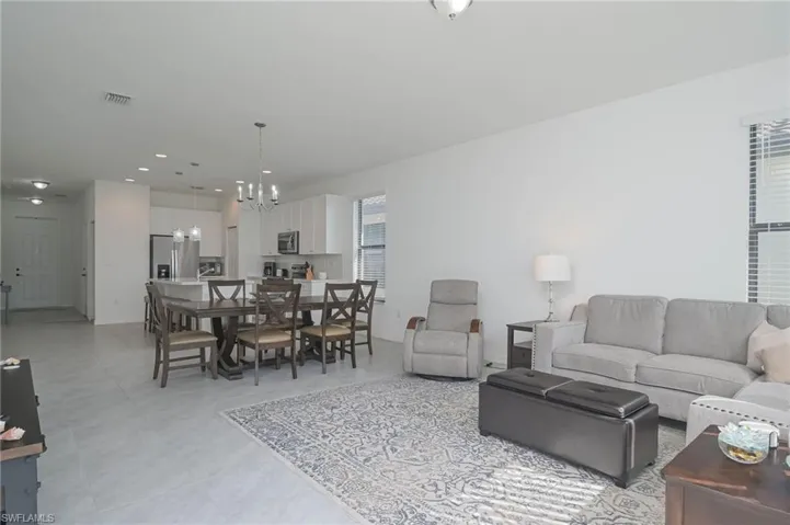 Living area featuring a chandelier and recessed lighting