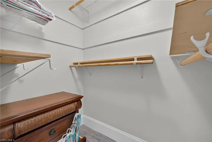 Integrated shelving and hanging rods in a neutral color palette