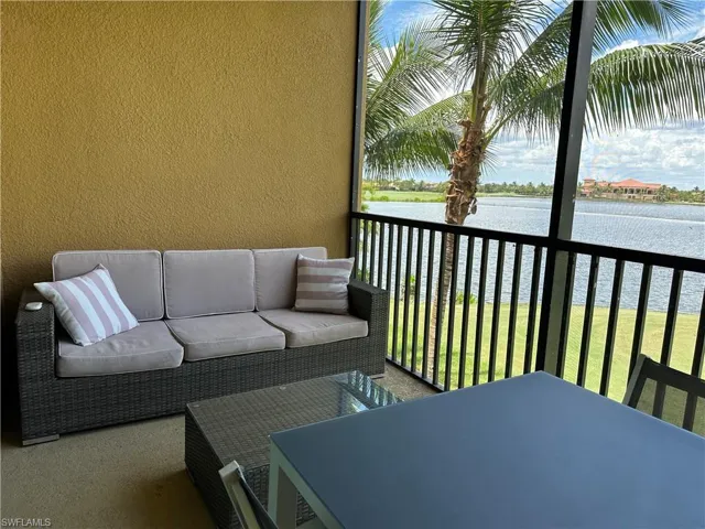 Balcony featuring outdoor lounge area and a water view